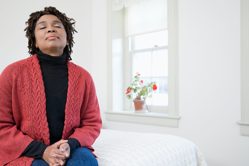 African American woman with her eyes closed