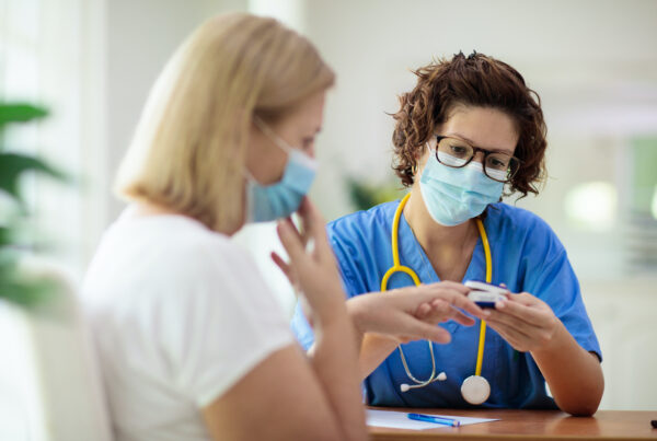 Doctor testing sick patient in health clinic