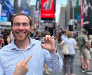 NEXT CEO Luke Fox holding a vial of Plan A gel