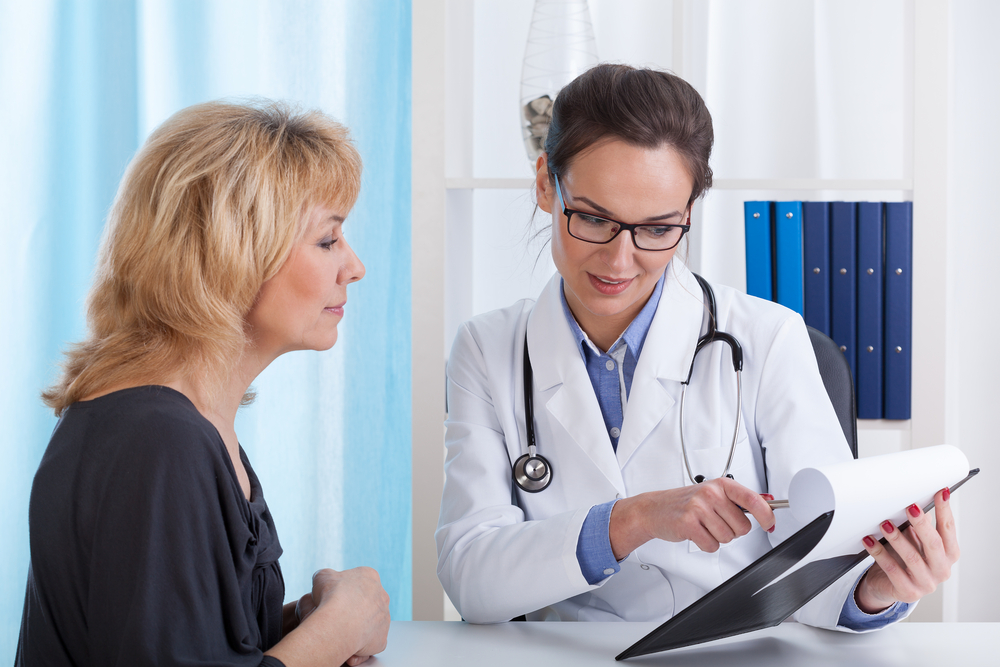 The need for menopause health information as shown by a woman talking to a doctor