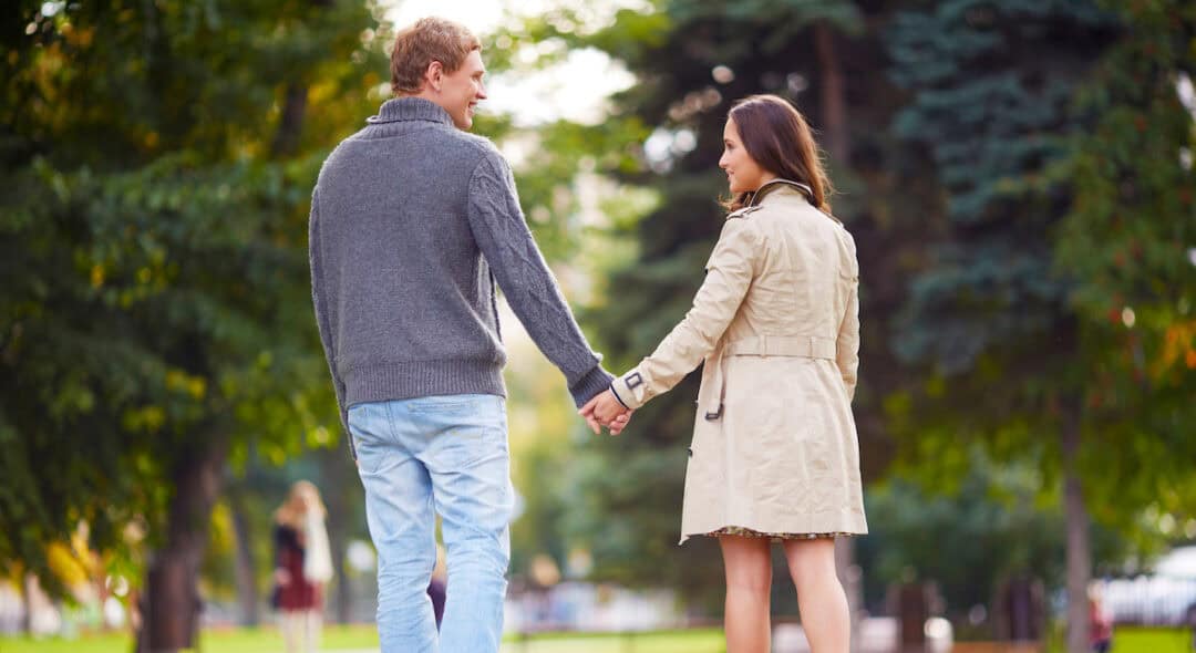 man and woman holding hands